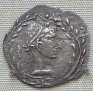 Coin depicting a man wearing a laurel wreath, modelled after the coinage of Augustus