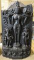 A basalt statue of Lalita flanked by Gaṇeśa and Kārttikeya
