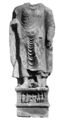 Statue with inscription mentioning "year 318", probably 143 AD.[59] The two devotees on the right side of the pedestal are in Indo-Scythian suit (loose trousers, tunic, and hood).[60]