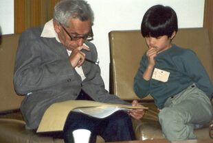 Paul Erdős (left) teaching a young Terence Tao (right).