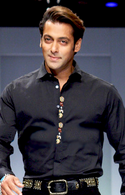 A smiling Salman Khan in a black shirt